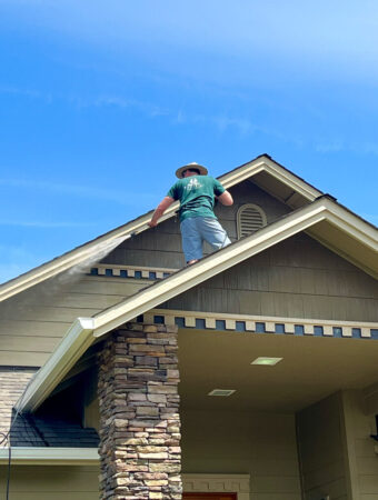 Pacific Home Painting power washing a house in Grants Pass